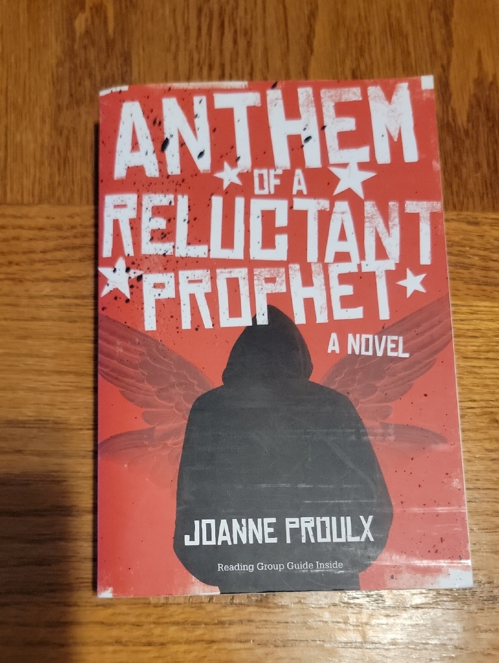 Anthem of a Reluctant Prophet A Novel by Joanne Proulx - Red Cover